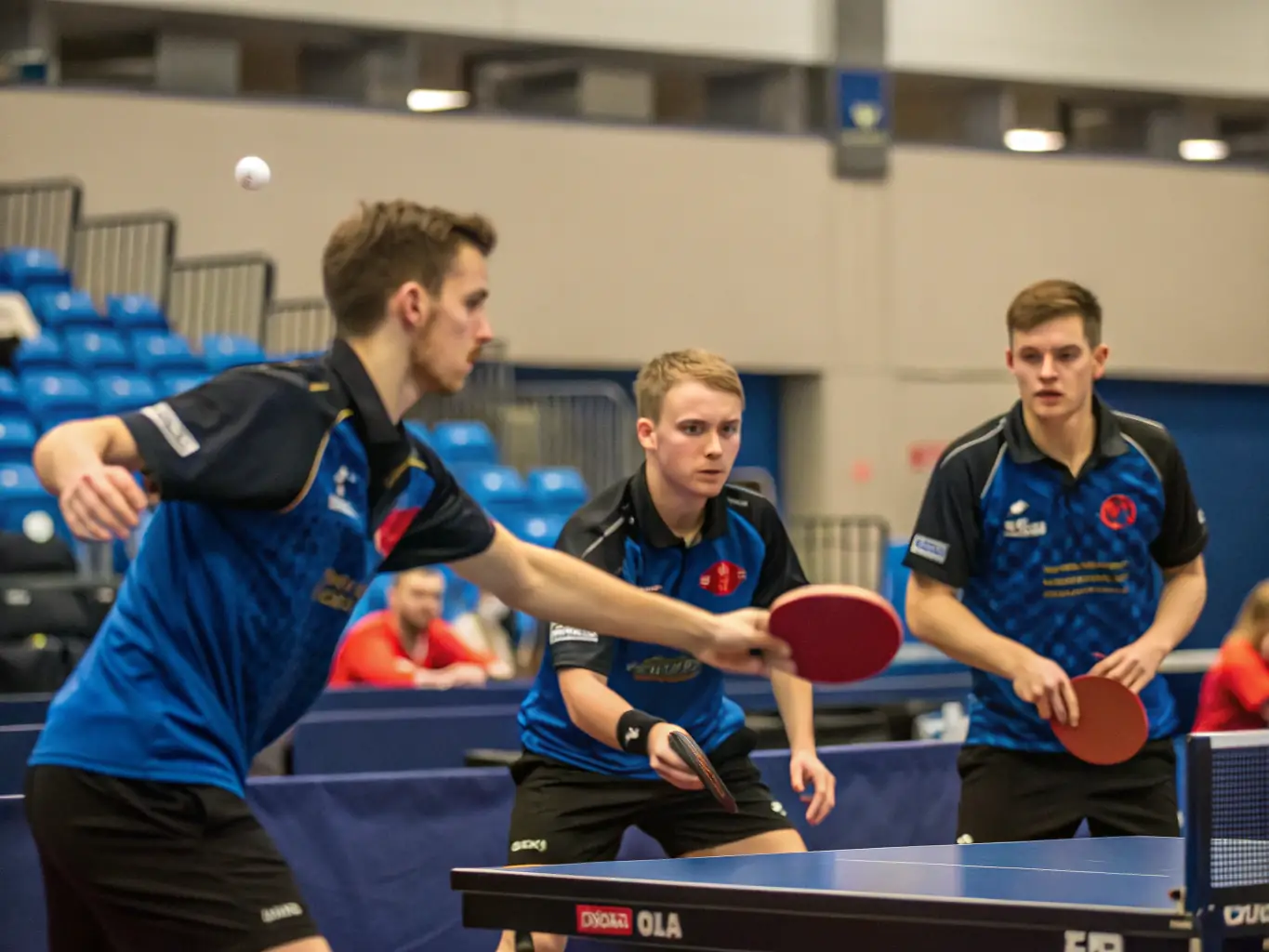 An image showcasing intermediate players engaged in a practice match, focusing on strategic gameplay and advanced techniques, under the guidance of a seasoned coach.